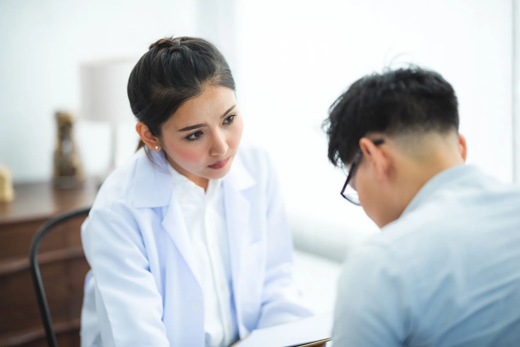A doctor explaining treatment options to a patient during a consultation