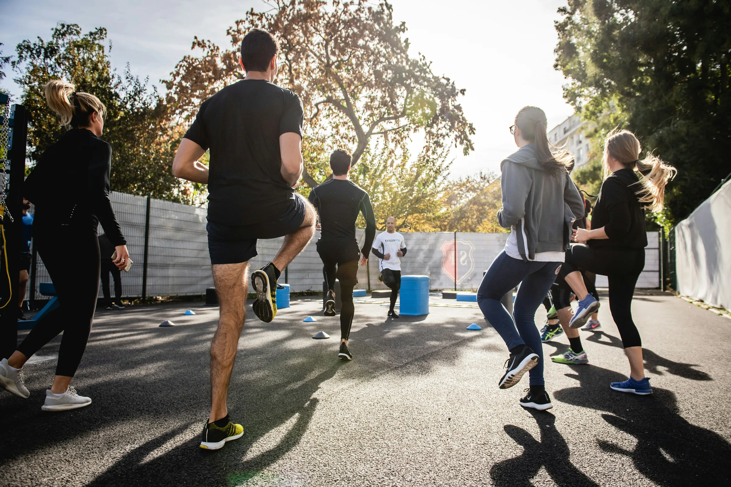 A group training outdoors on an open court